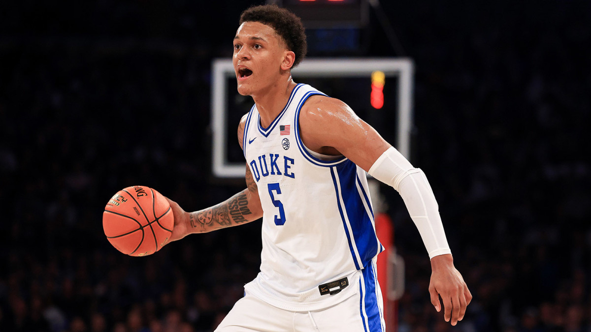 Duke Blue Devils forward Paolo Banchero (5) dribbles against the Kentucky Wildcats.